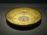 A beautifully crafted ceramic plate with intricate designs.
