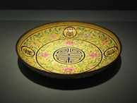 An elegant ceramic plate with floral patterns.