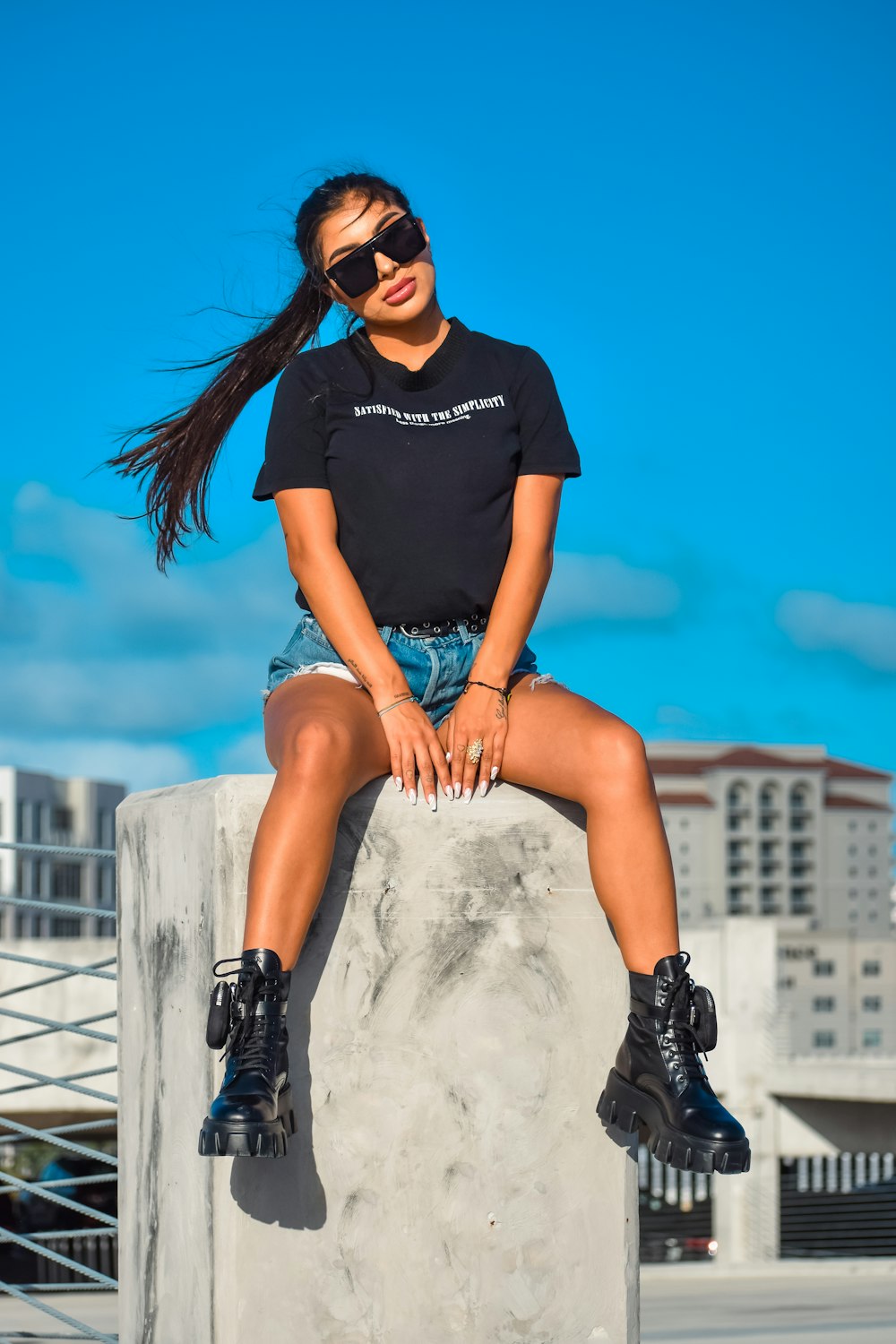 a person sitting on a railing