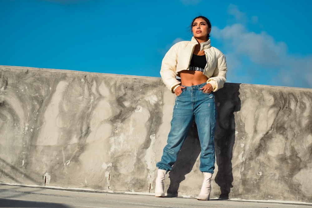 a man leaning against a wall