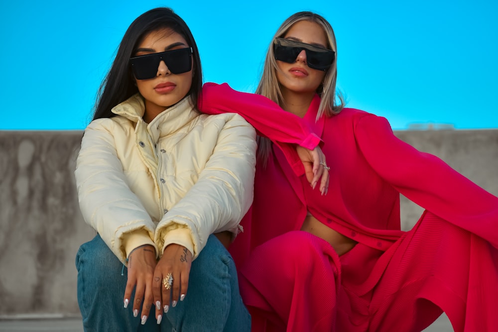 two women wearing sunglasses