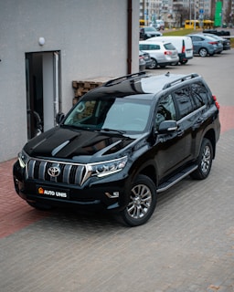 A secure transportation vehicle parked outside a corporate building.