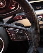 a steering wheel and dashboard of a car