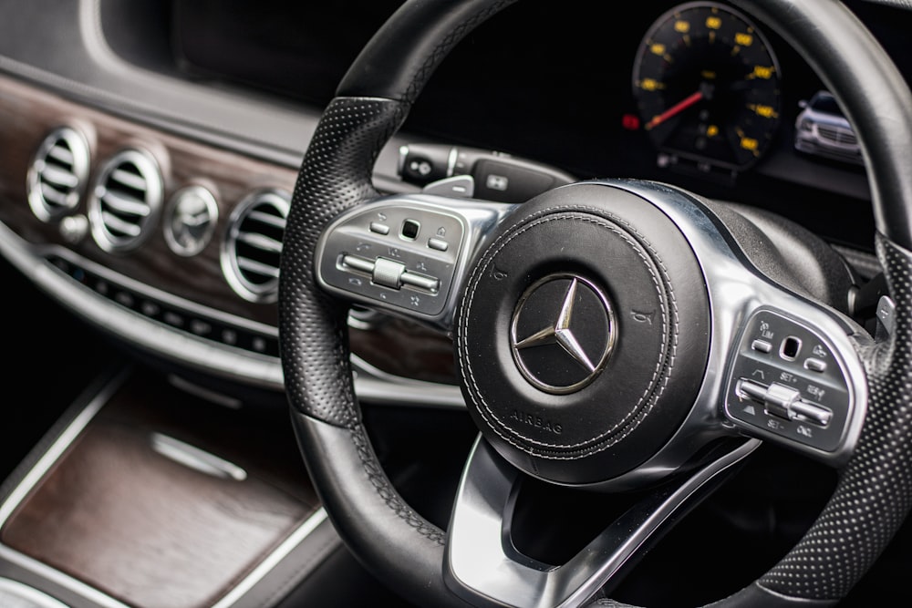 the steering wheel and dashboard of a car