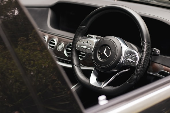 a steering wheel and dashboard of a car