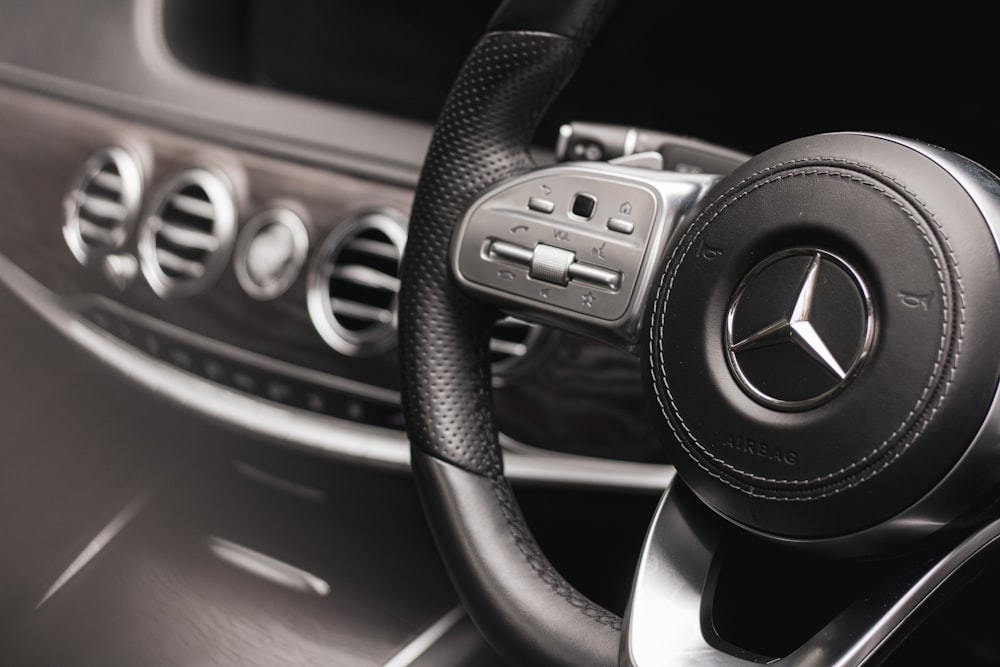 a steering wheel and dashboard of a car