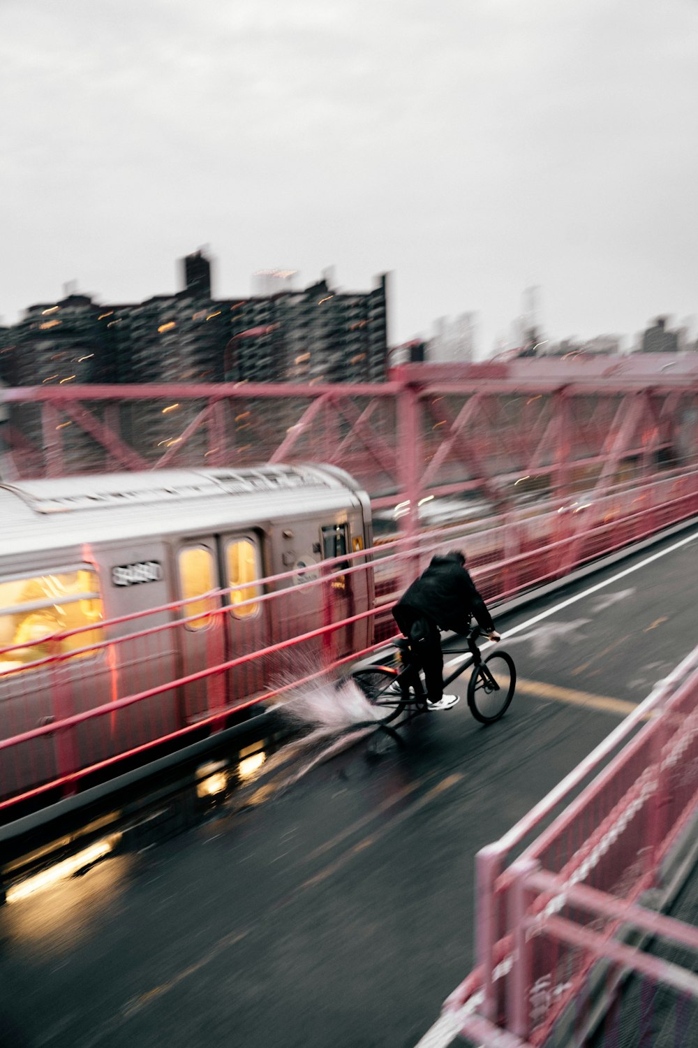 a person riding a bicycle on a bridge