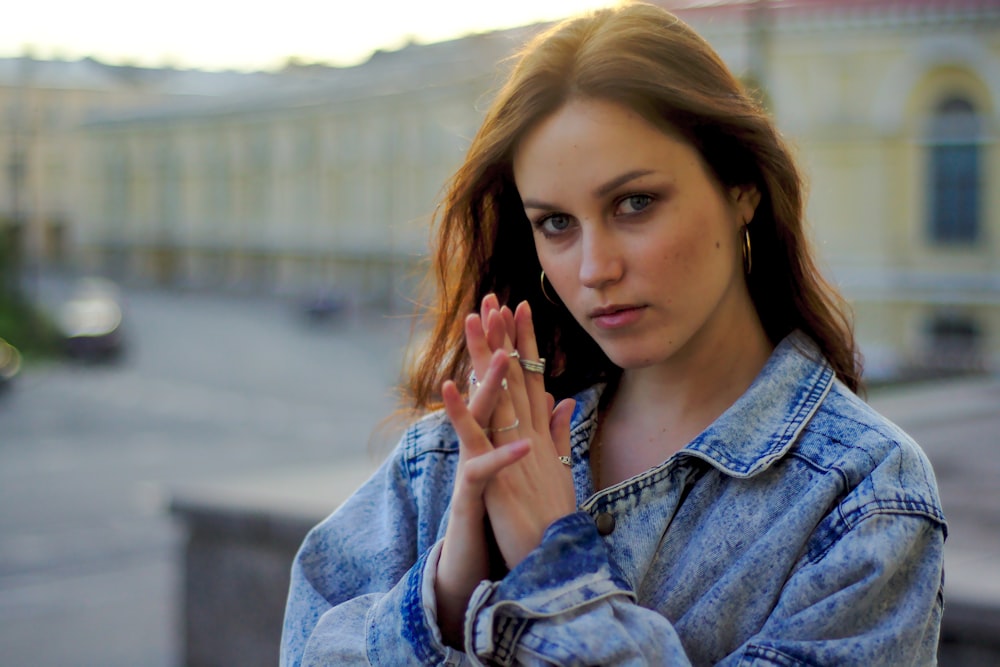 a woman with her hand on her face