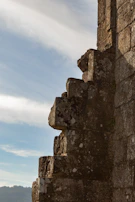 Close-up of weathered stone walls that once formed the hillfort's defensive barrier.