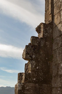 Close-up of weathered stone walls that once formed the hillfort's defensive barrier.