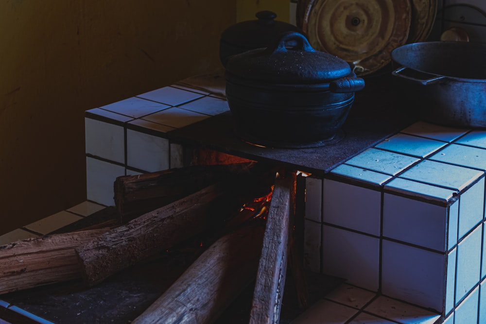 a kitchen with a blue pot and wood floor