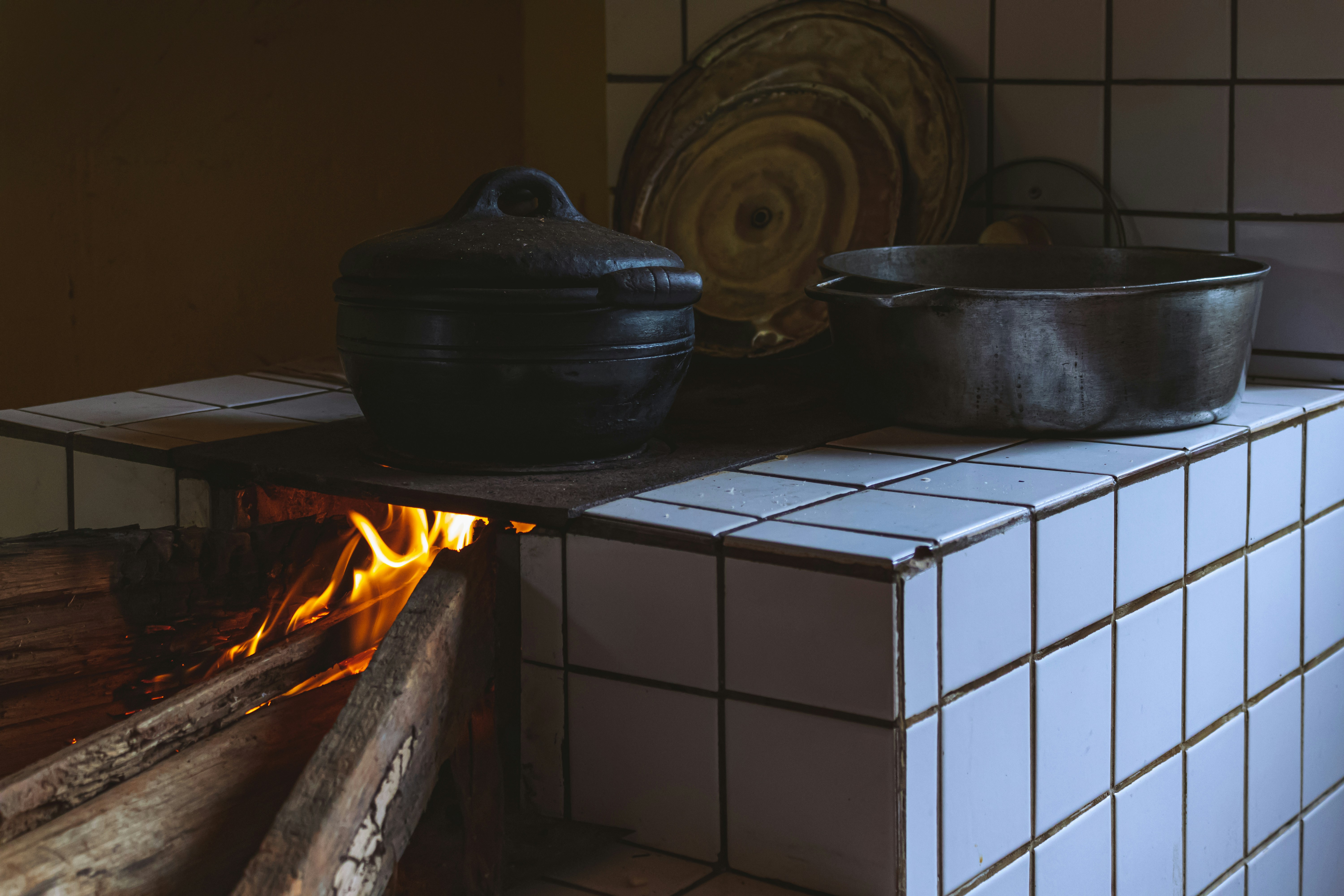a fire pit with pots on it