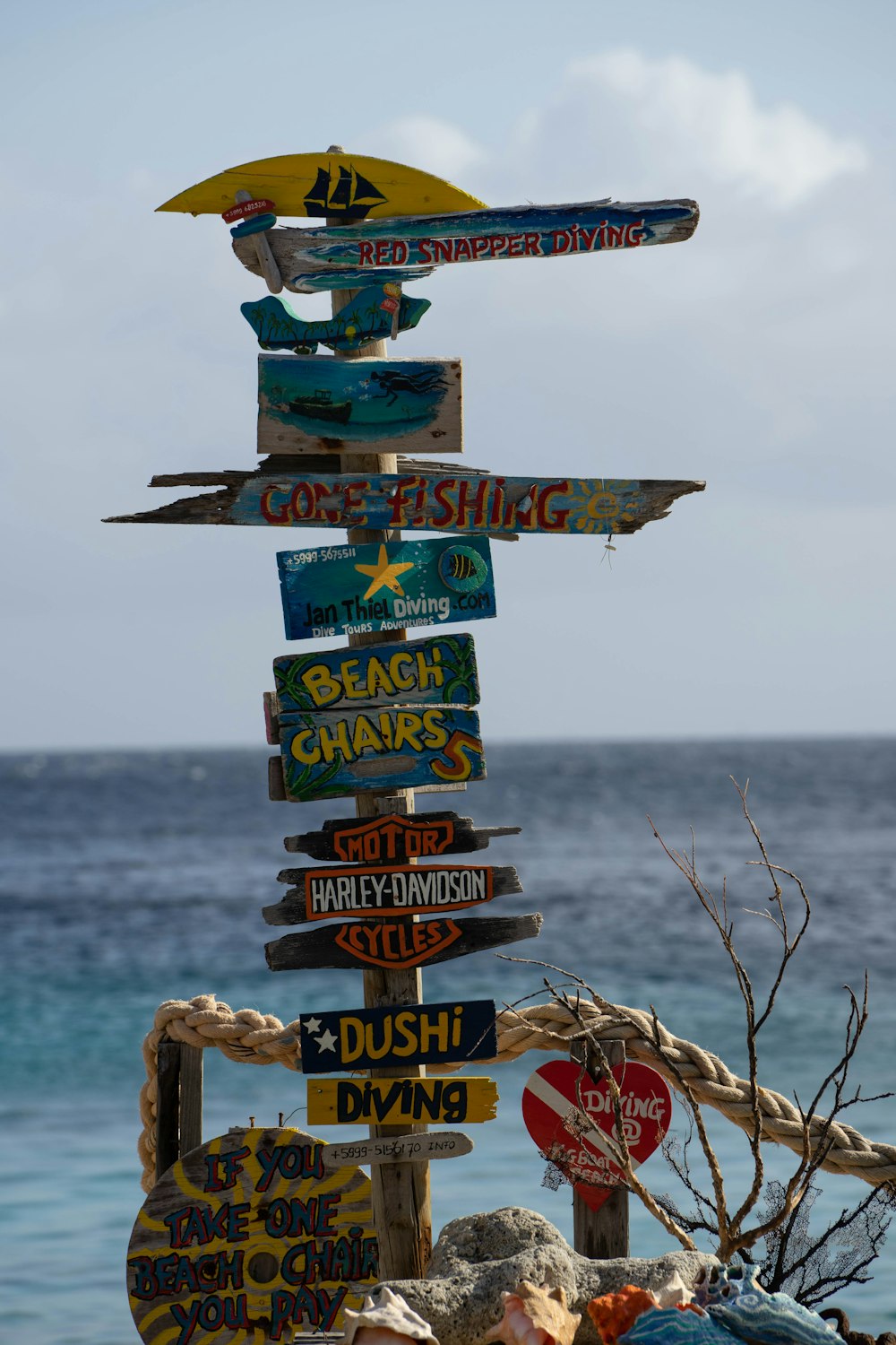 a sign post with many signs on it