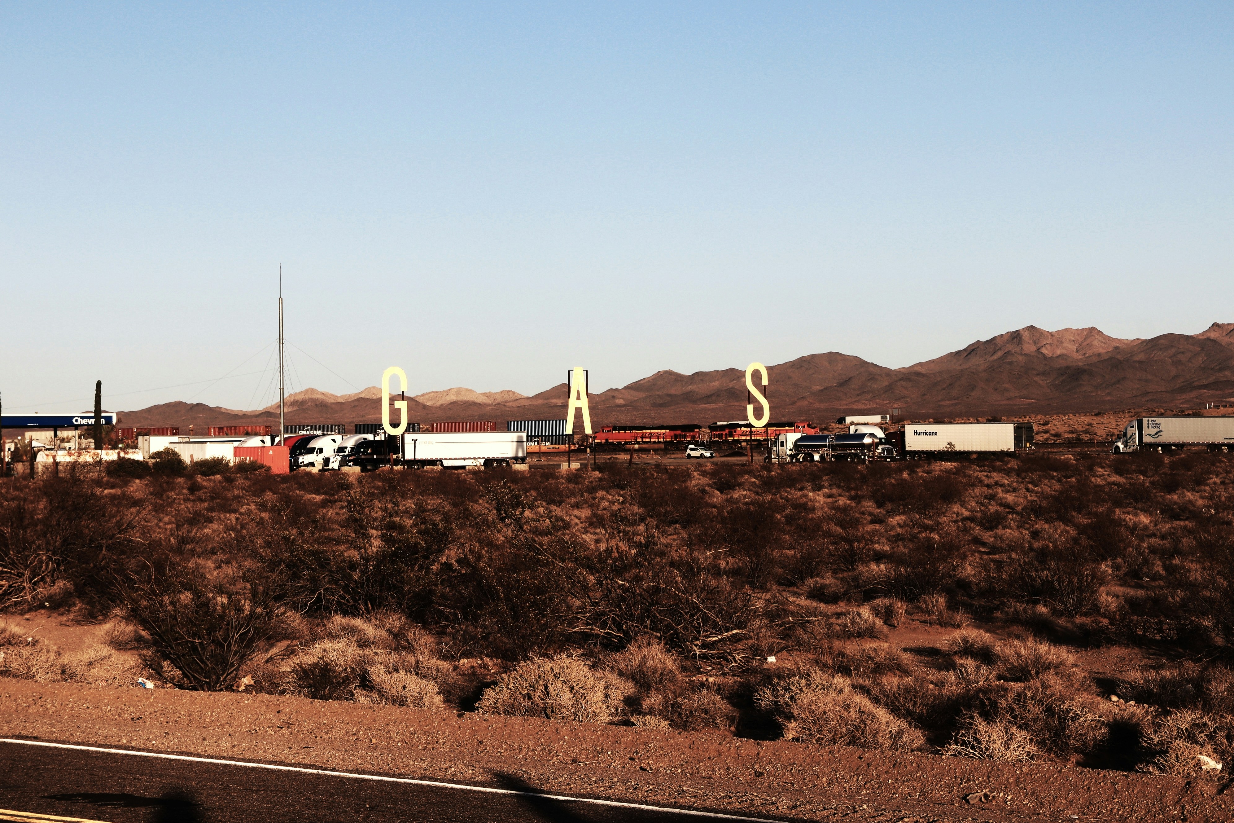 a group of trailers parked in a desert