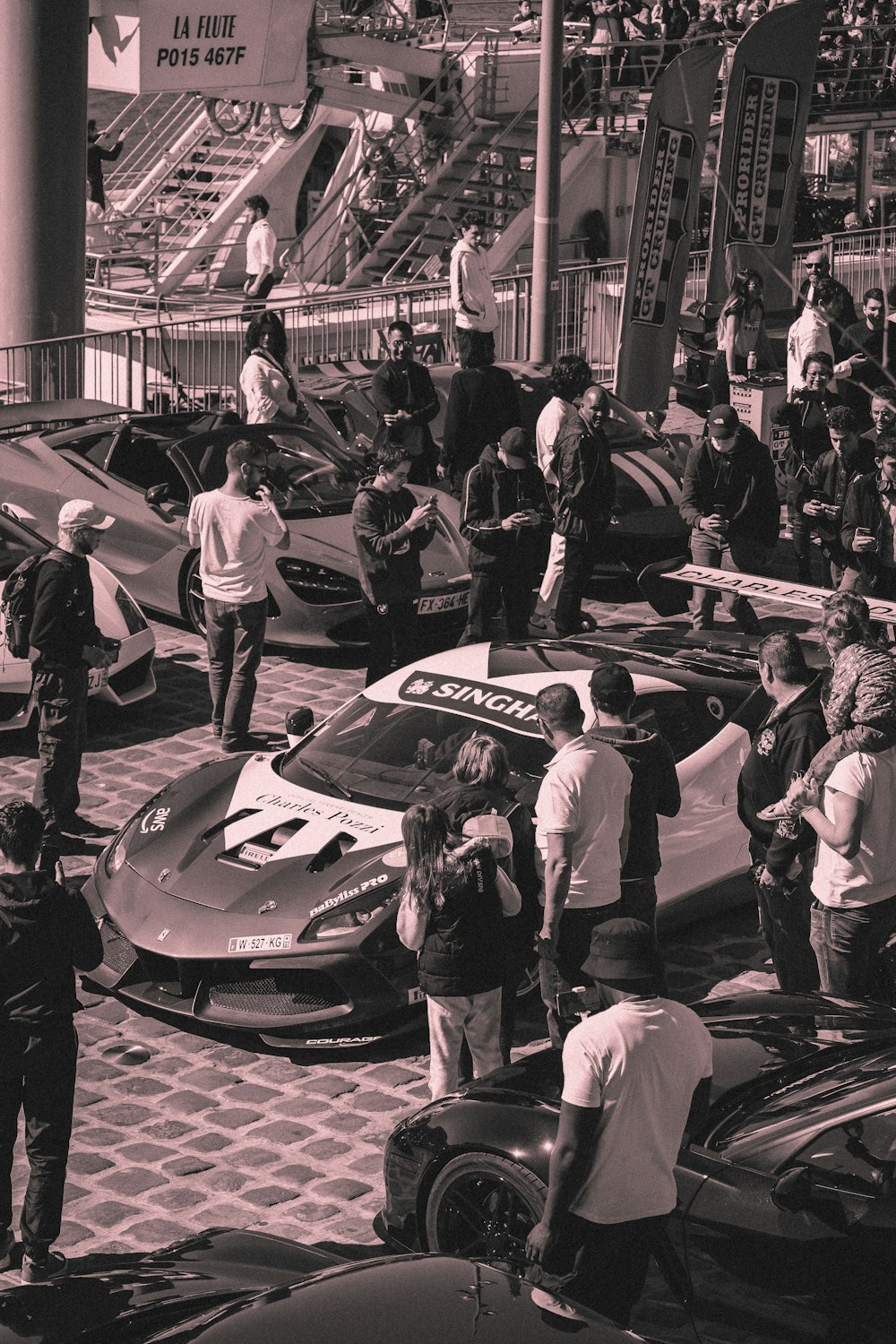 a group of people around a car