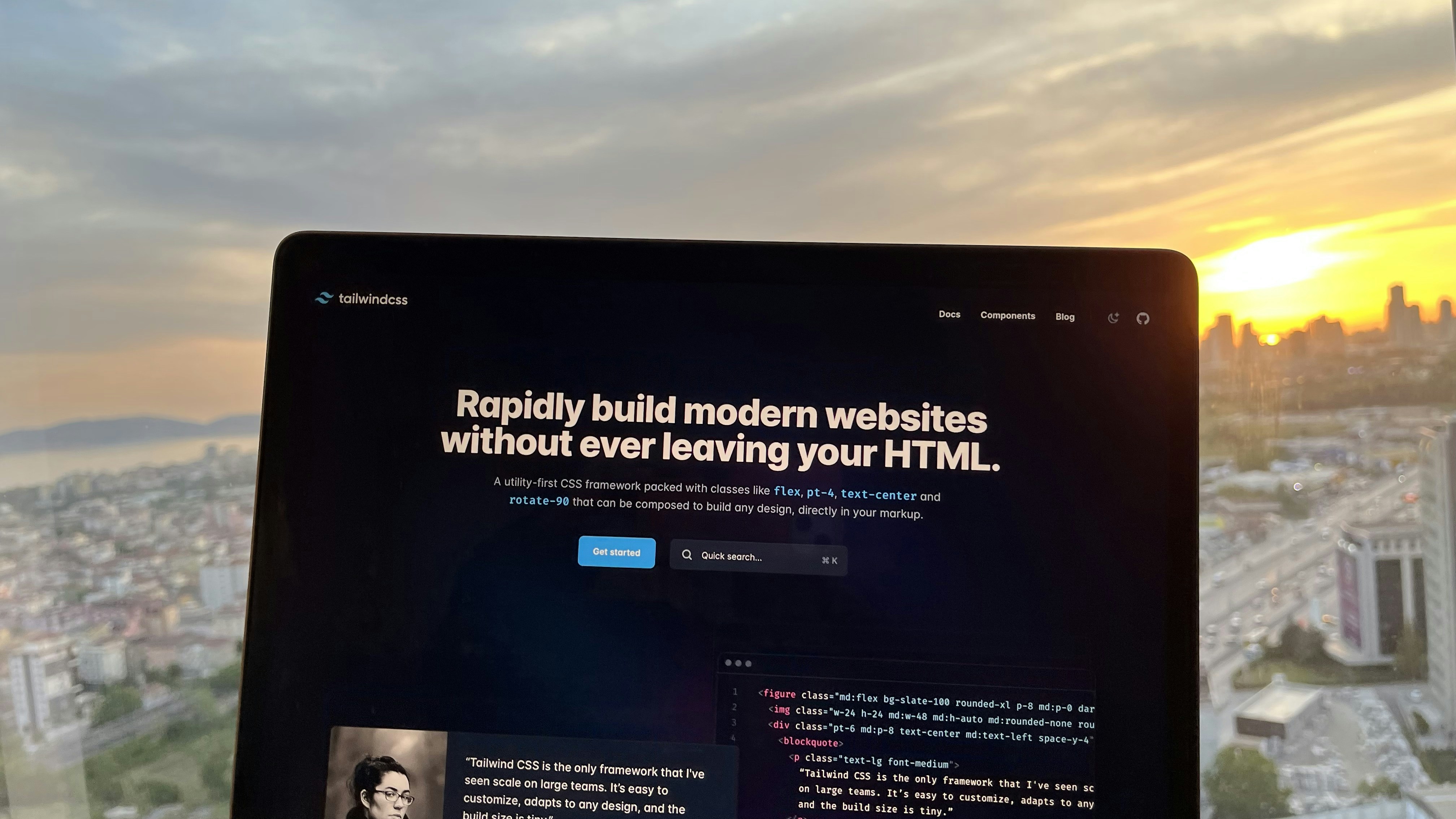Tailwind CSS UI blocks code on laptop screen
