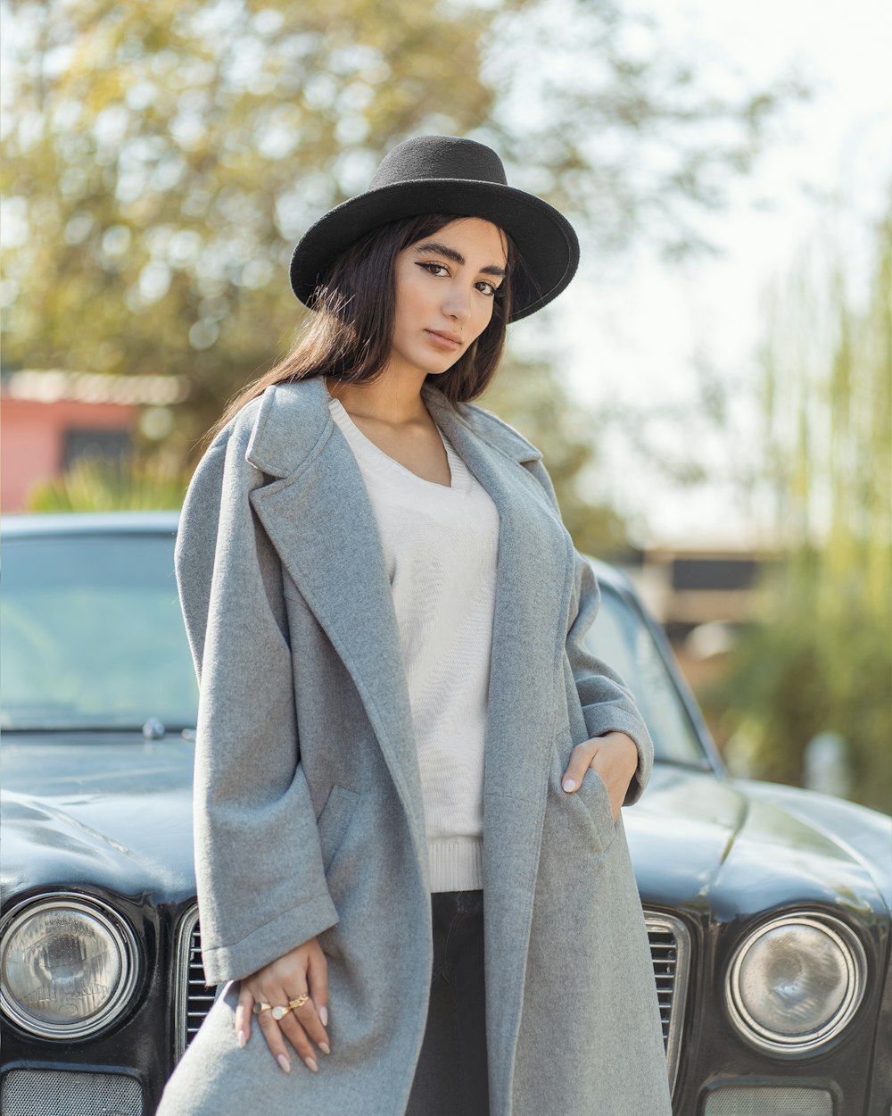 a person standing in front of a car