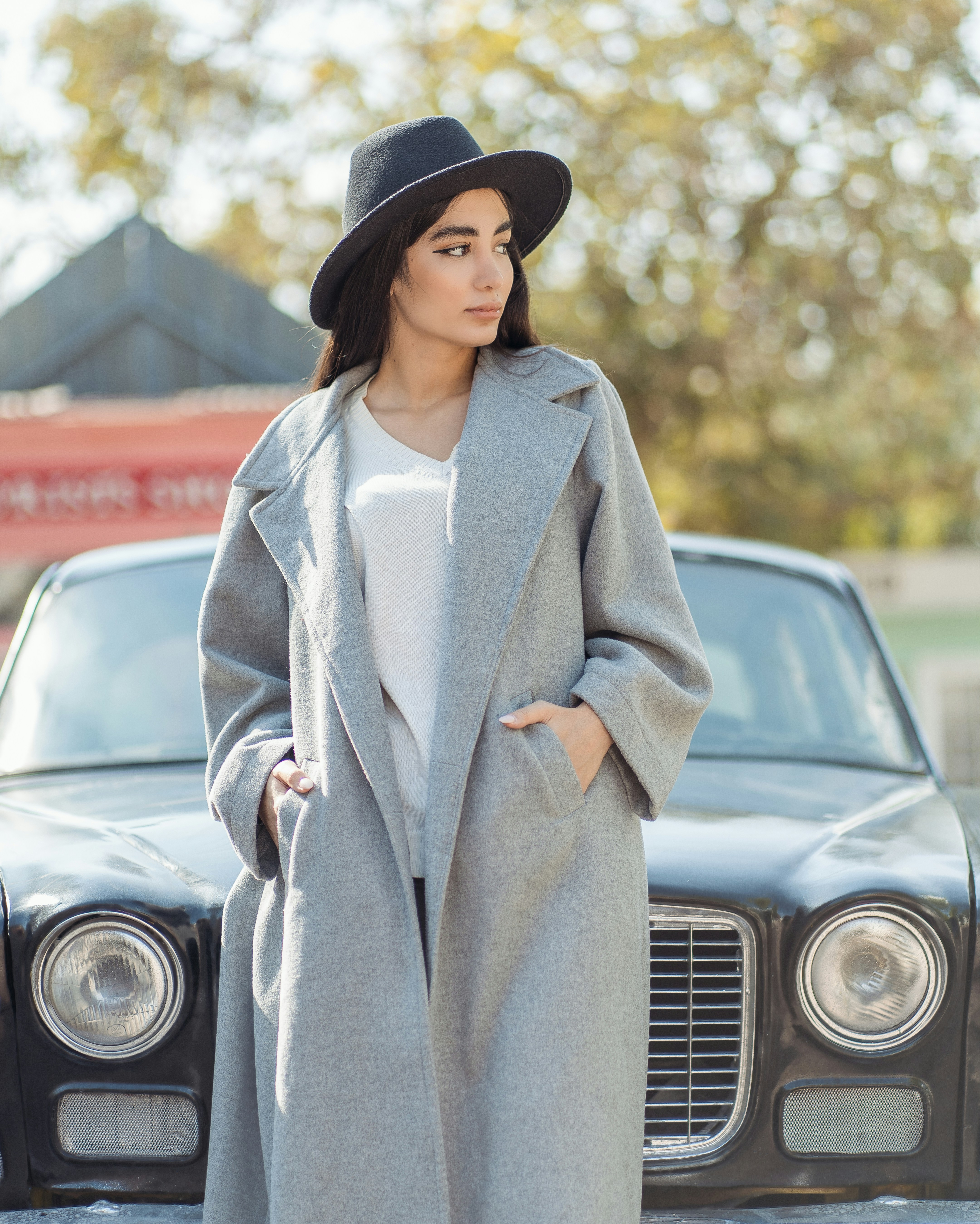 a person standing in front of a car