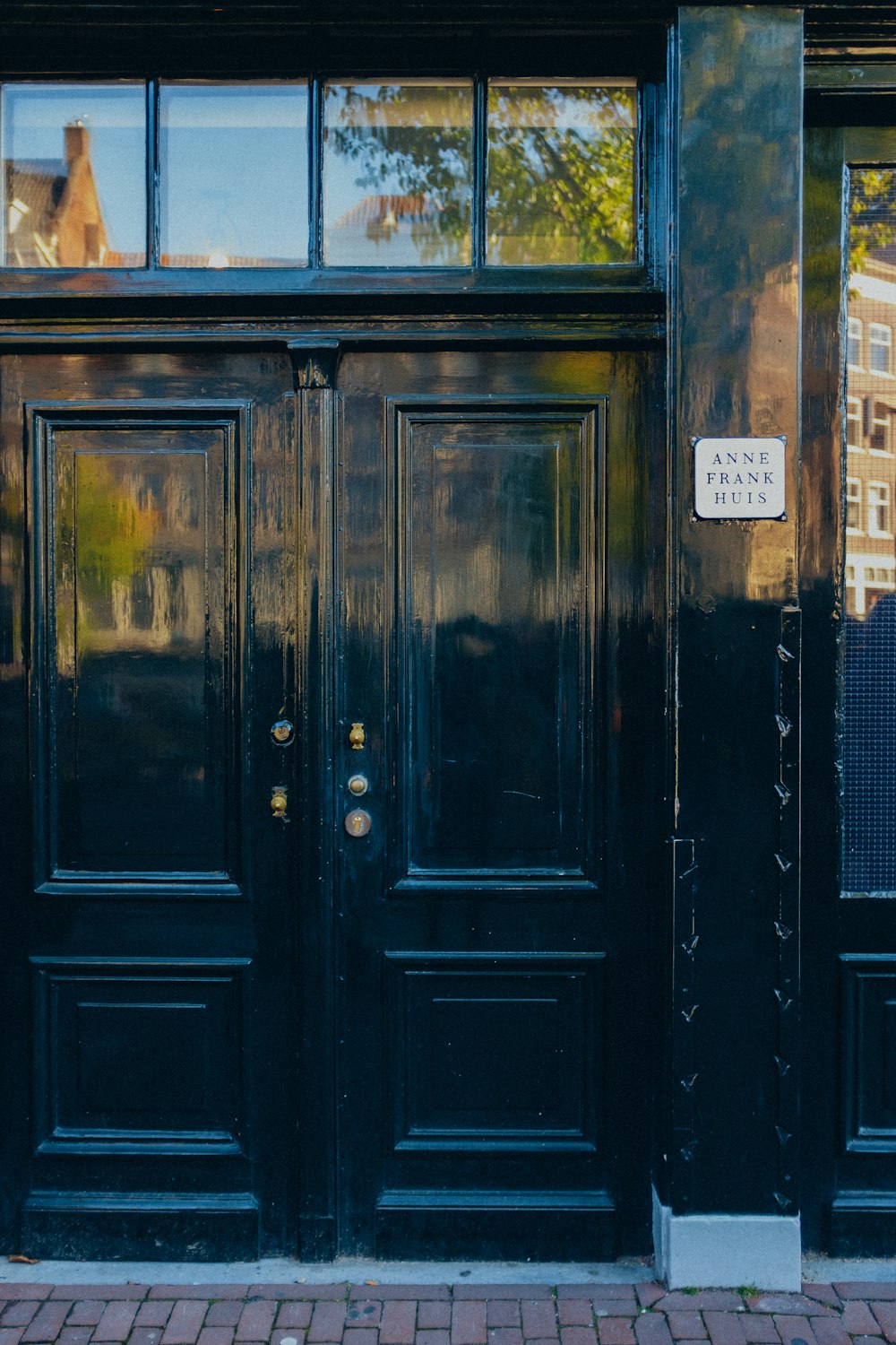 a black door with a sign on it