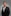 a man in a suit posing for a picture