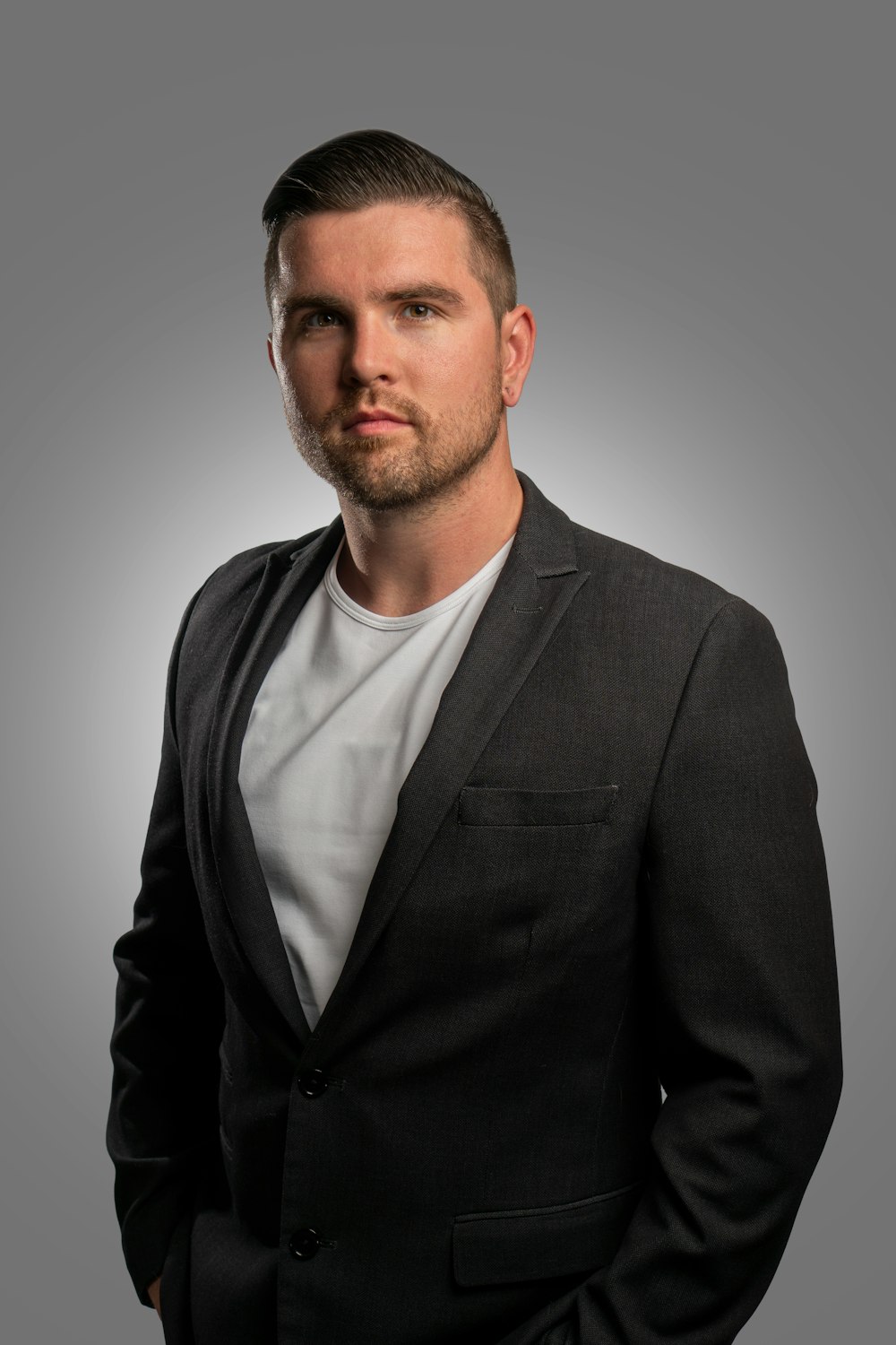 a man in a suit posing for a picture