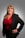 a woman in a red shirt and black jacket