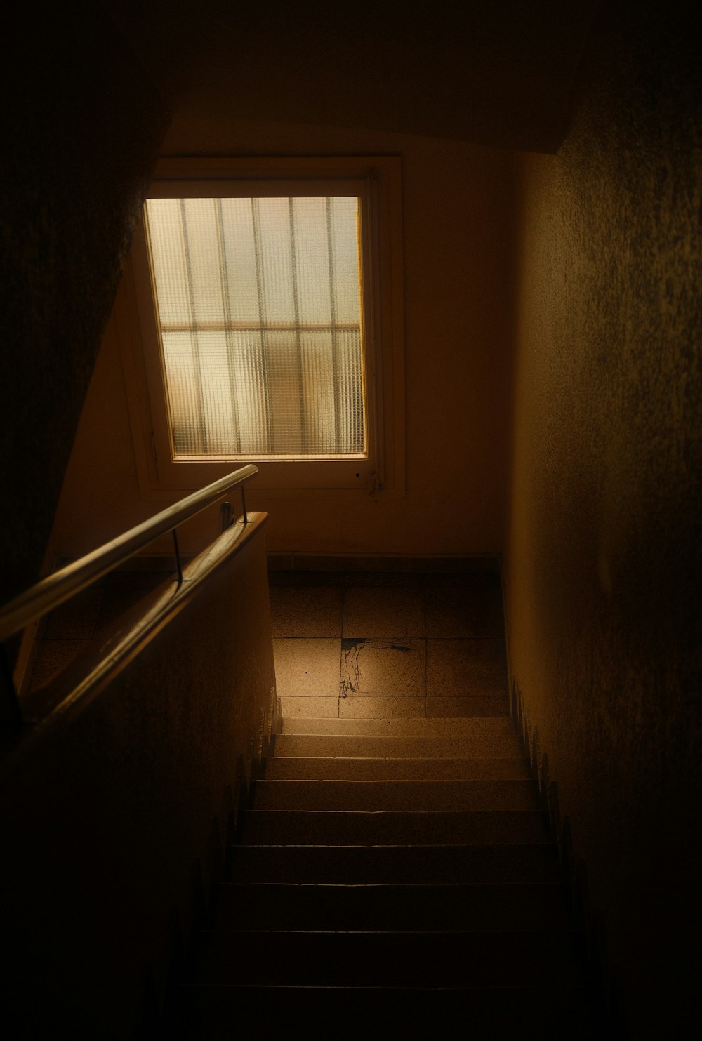 a staircase leading to a window