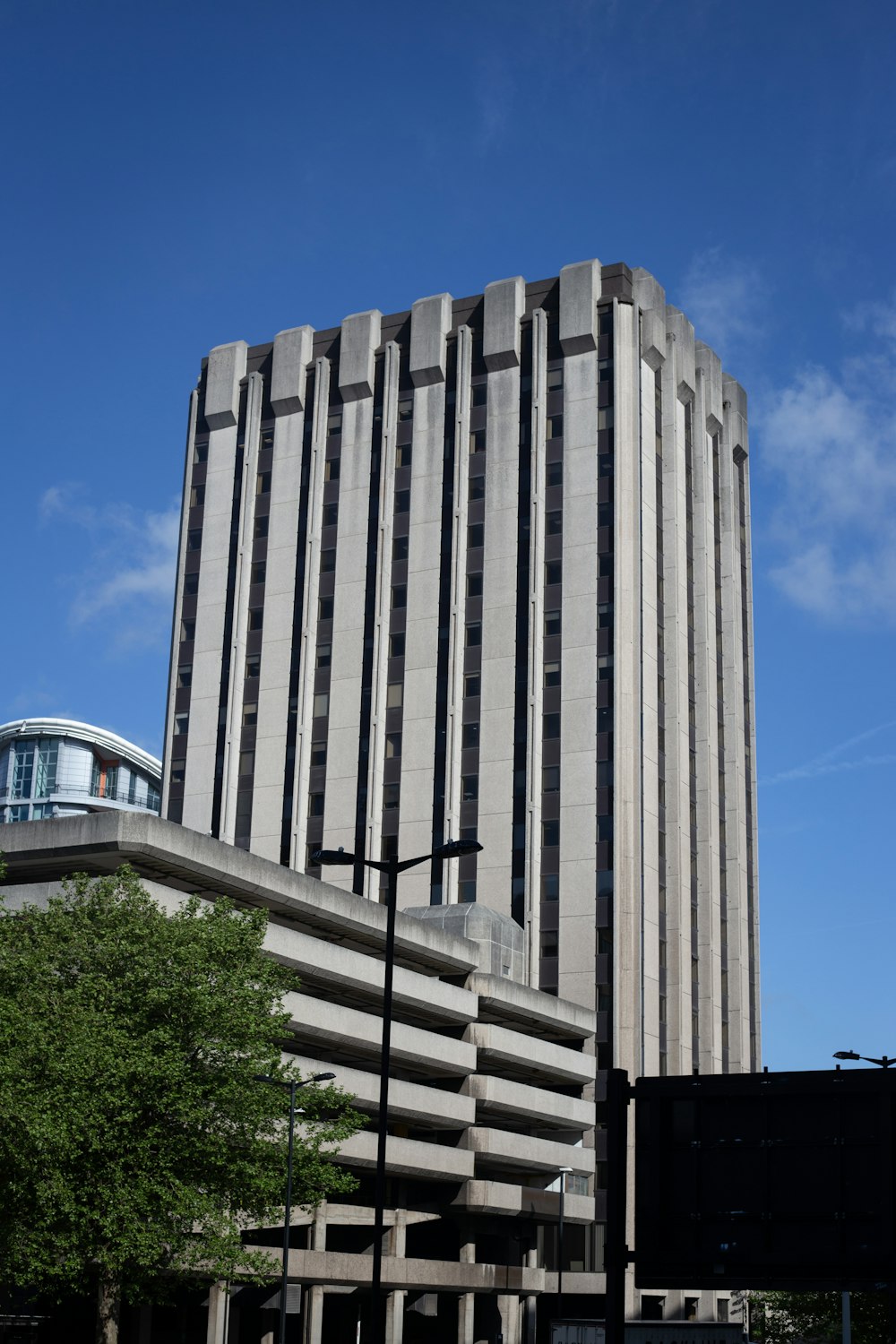 a tall building with a tree in front of it