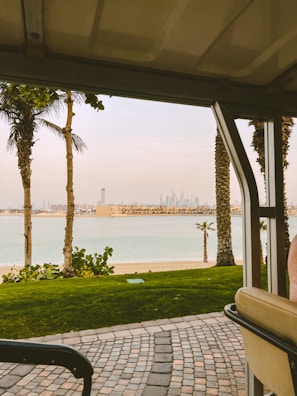 A scenic view of Miami skyline seen through the window of a moving luxury vehicle