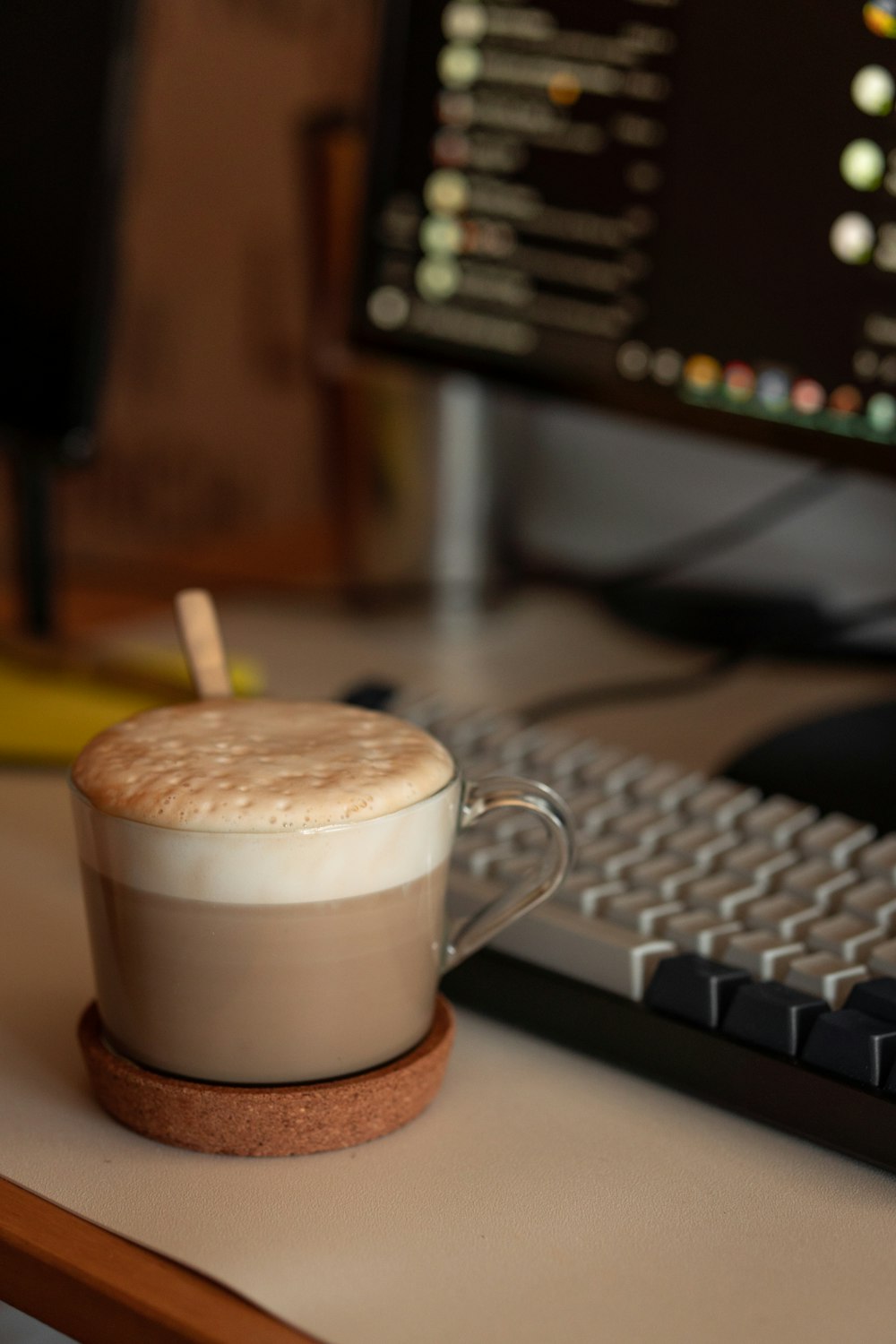 a cup of coffee on a desk