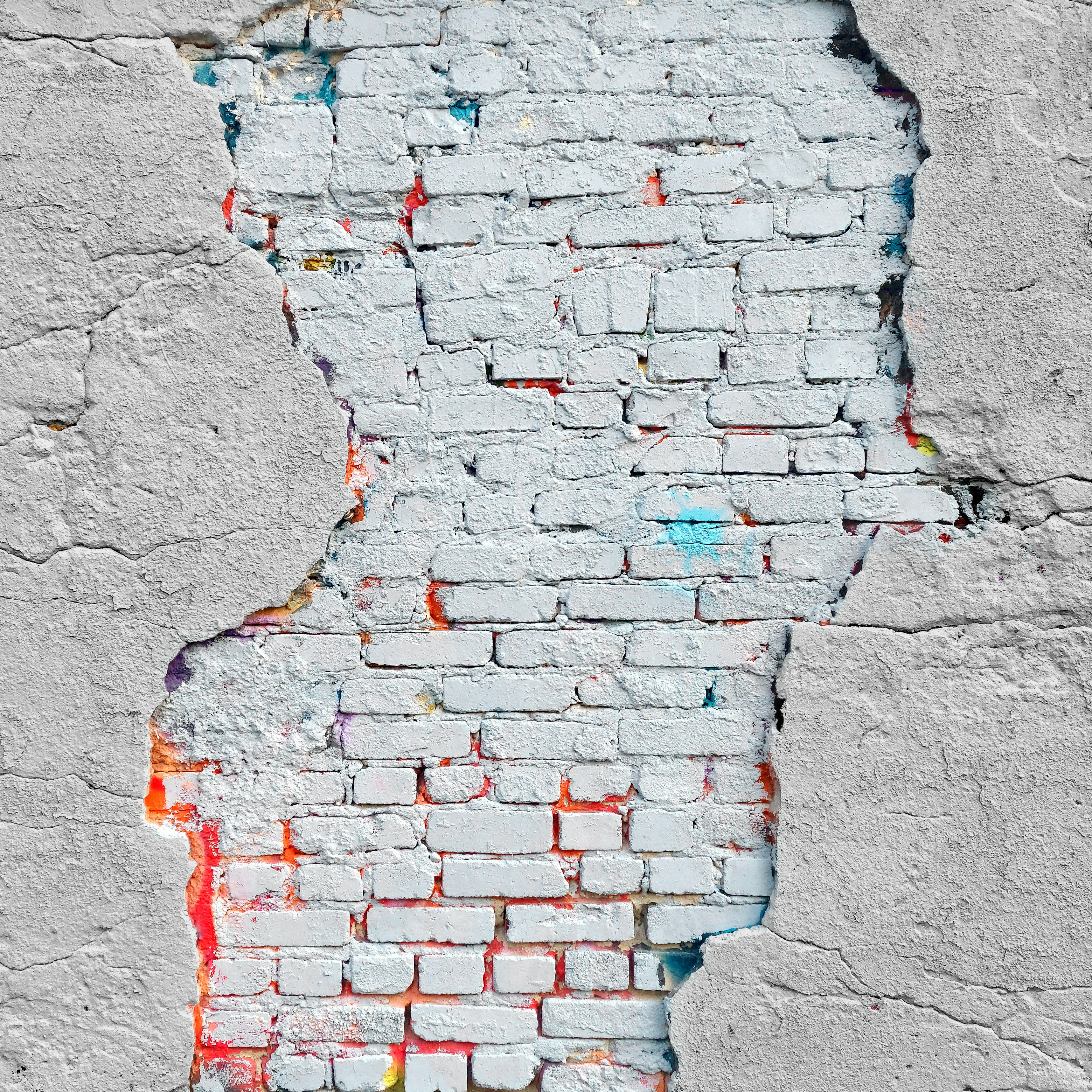 a brick wall with a hole in it