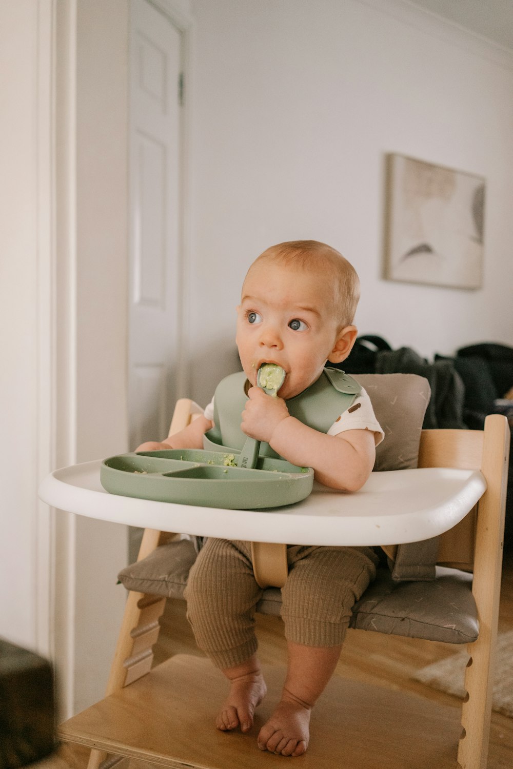 a baby eating from a bowl