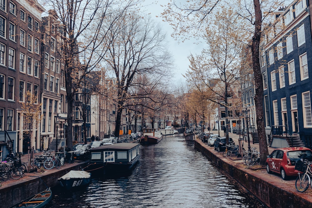 a canal with boats and buildings along it