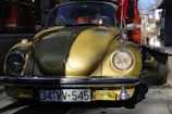 A bright yellow Sarıtaksi car parked in front of the main taxi stand on a sunny day