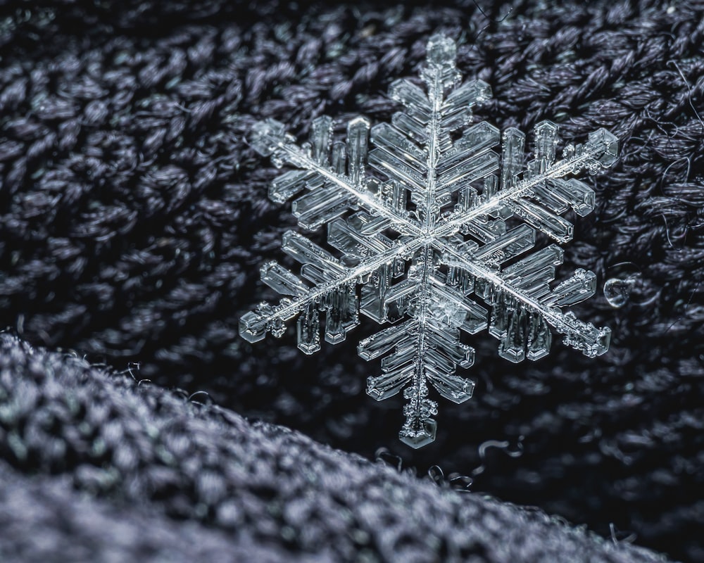 a snowflake on a black background