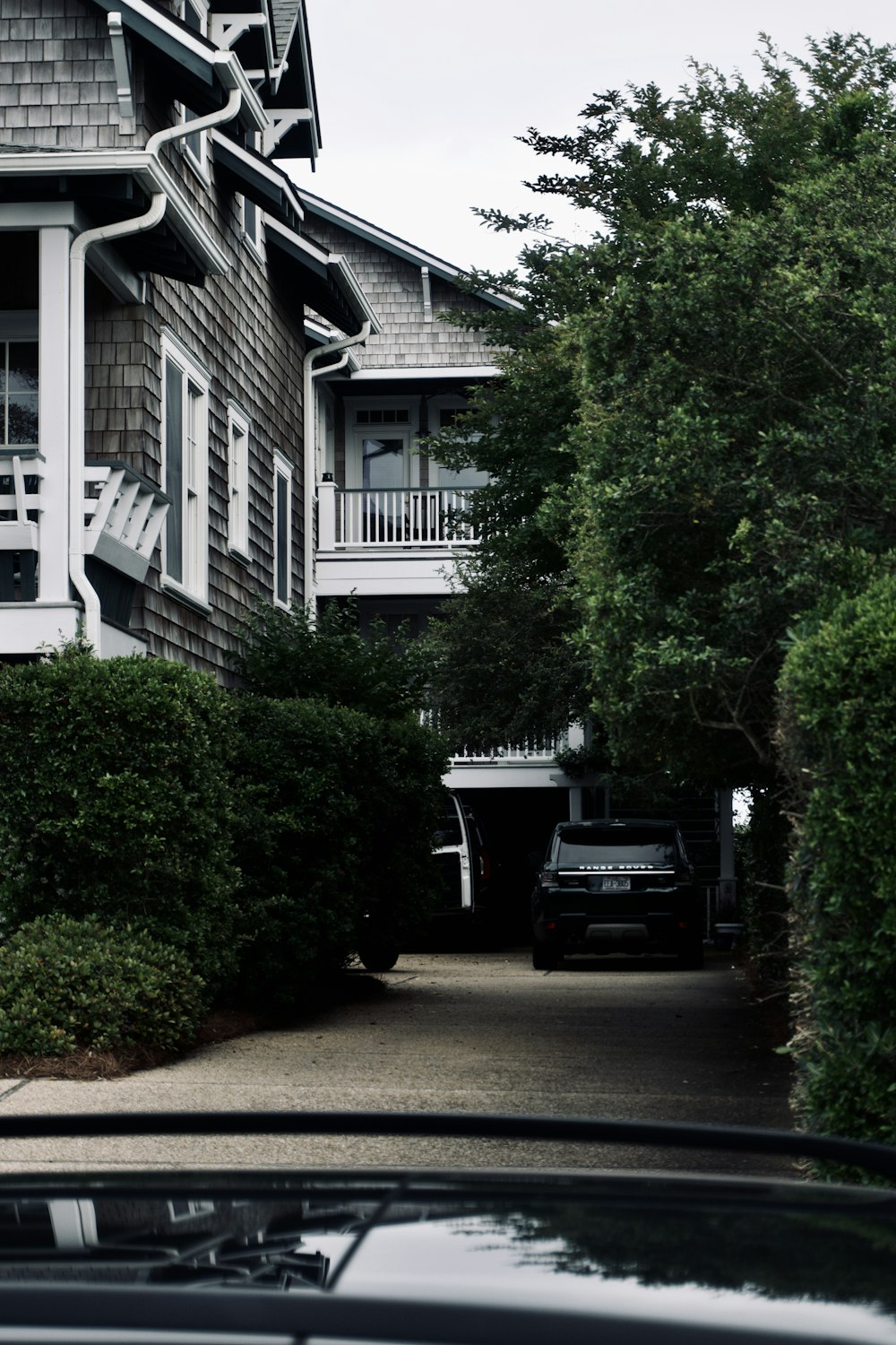 a car parked in front of a row of houses