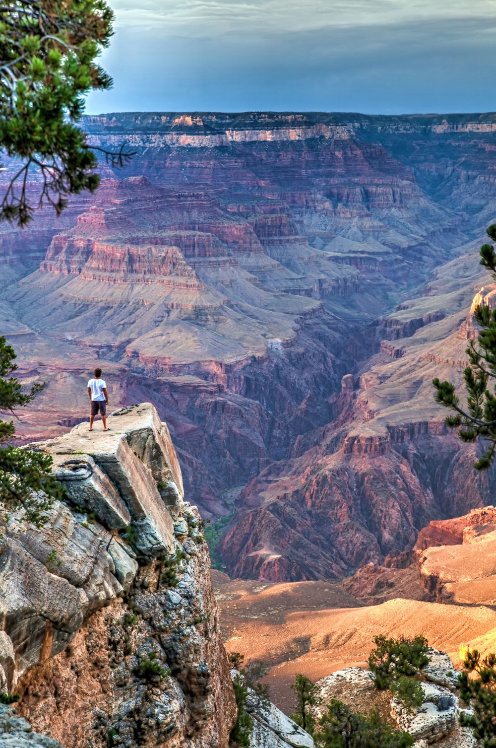 a person standing on a cliff