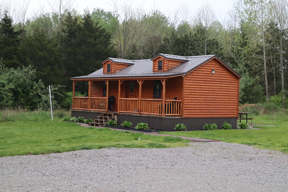 a wooden house with a grass yard