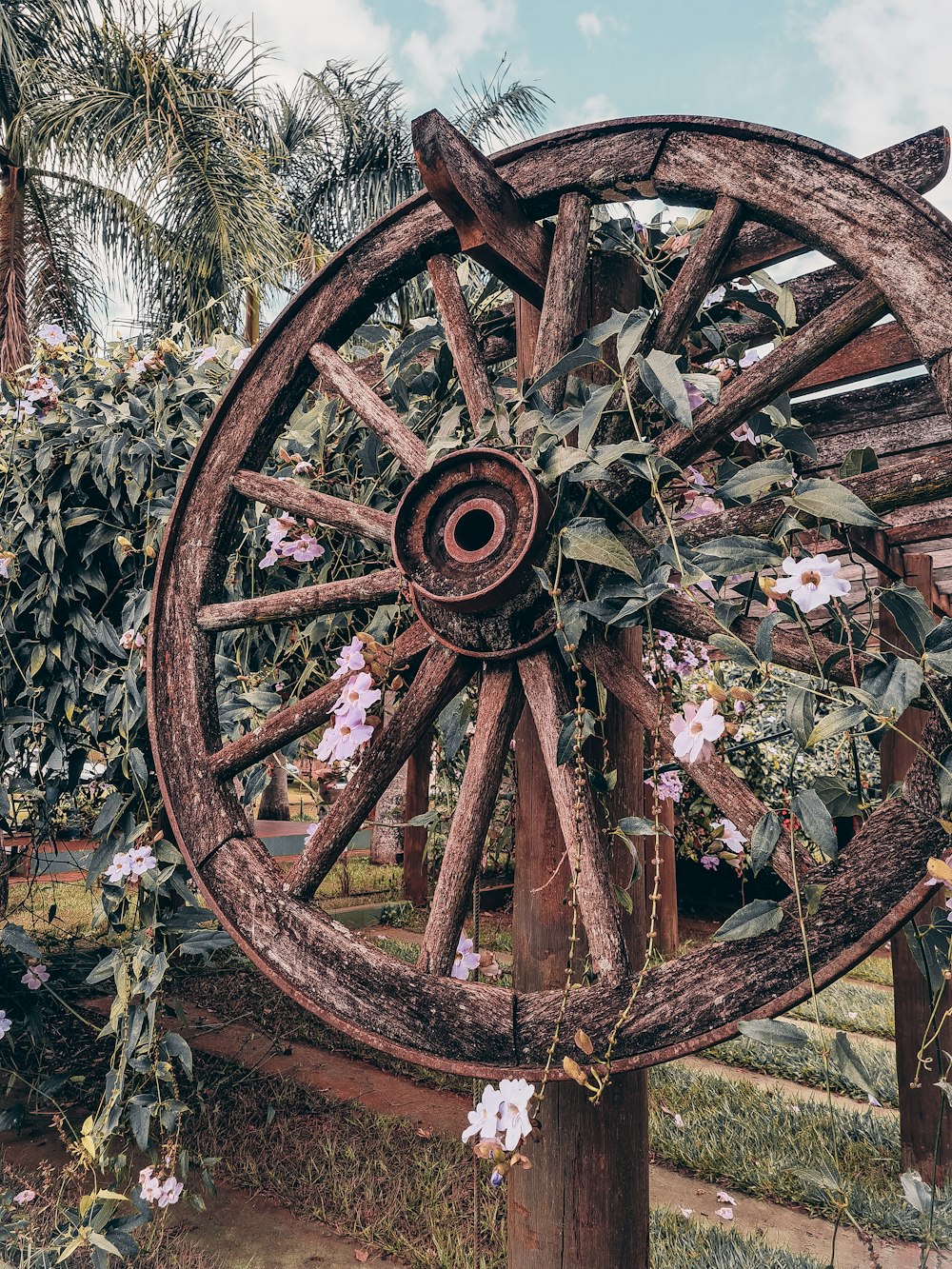 a wooden wheel with flowers