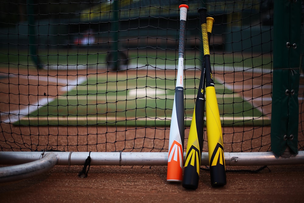 a group of yellow and black poles