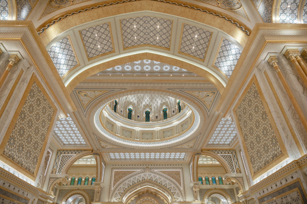 a large ornate ceiling with people