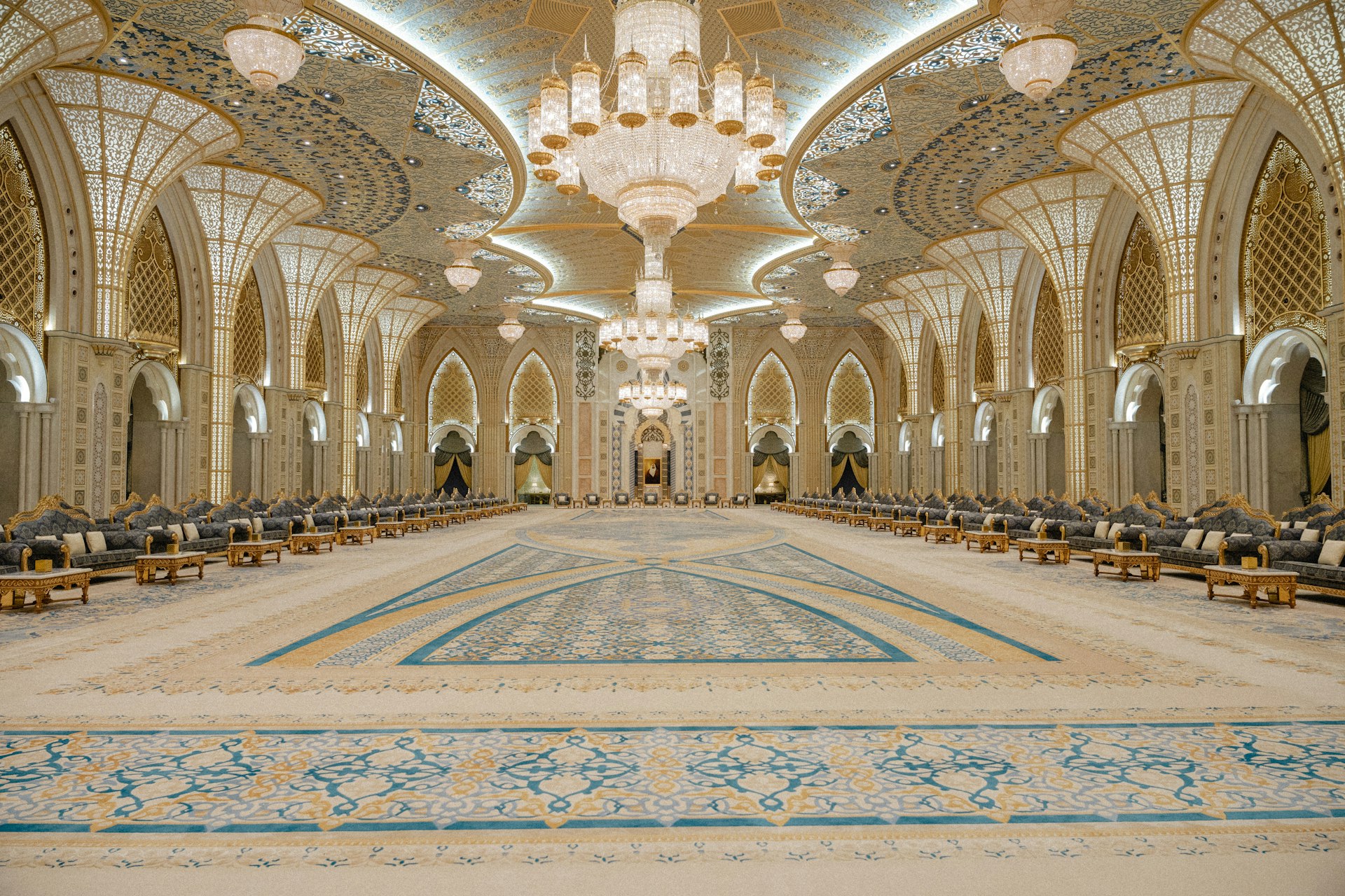 a large room with a large chandelier and a large pool