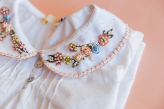a white dress with gold jewelry