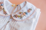 a white dress with gold jewelry