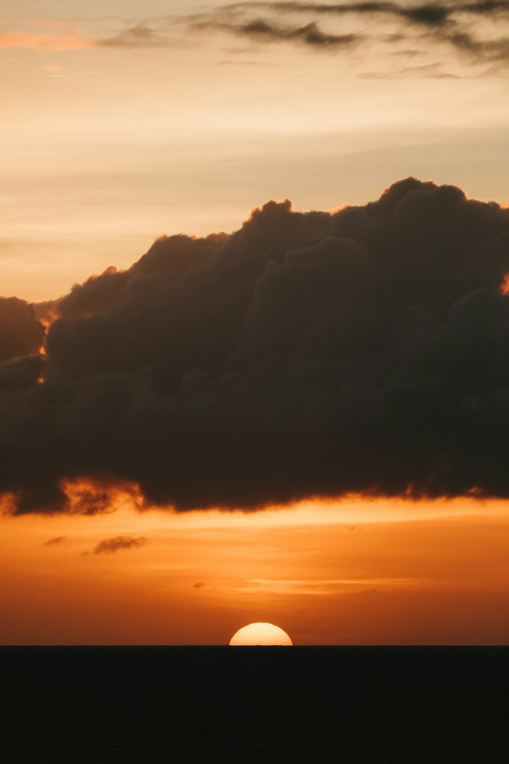 a sunset over a mountain