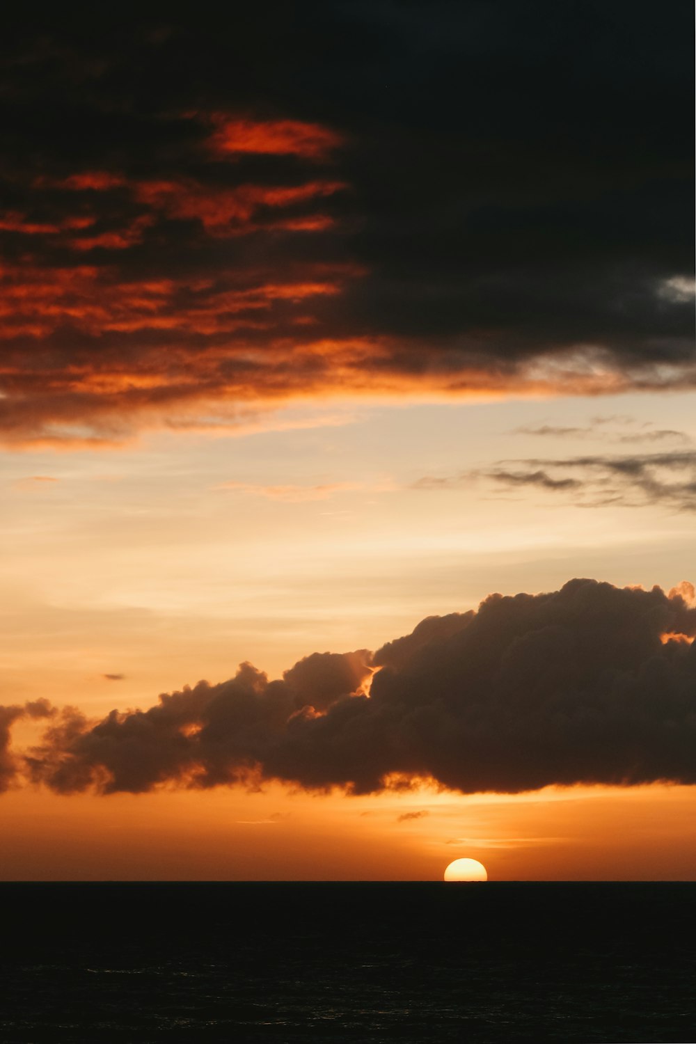 a sunset over a body of water