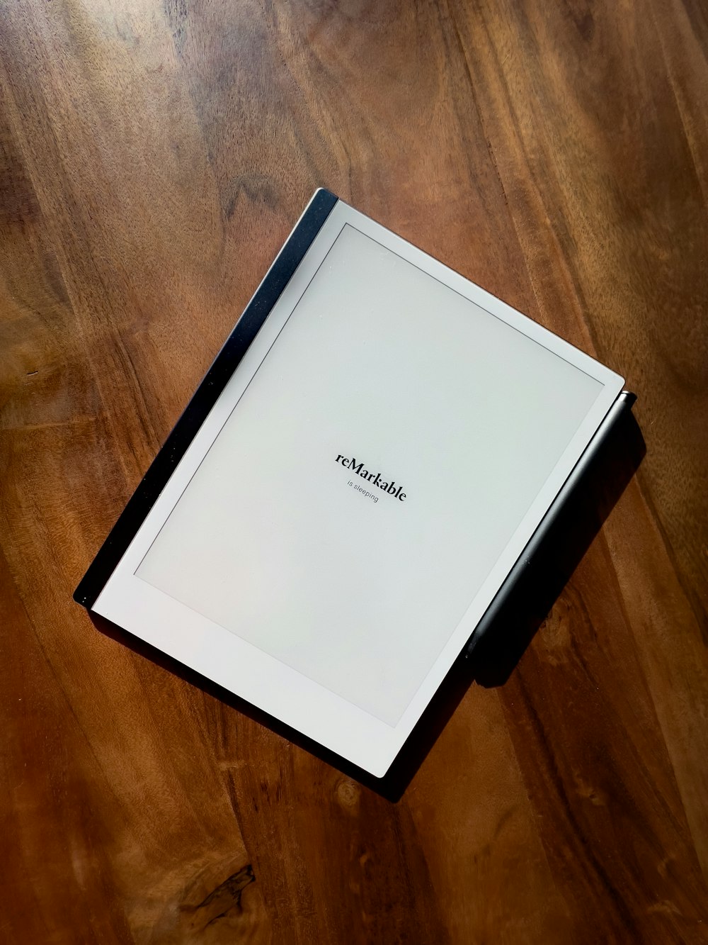 a laptop computer sitting on top of a wooden table