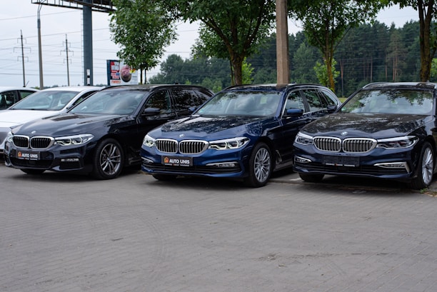a group of cars parked in a parking lot