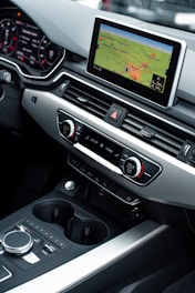 a car dashboard with a game on the screen