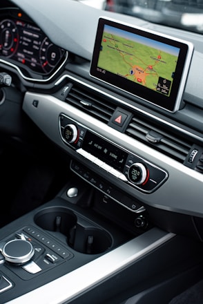 a car dashboard with a game on the screen